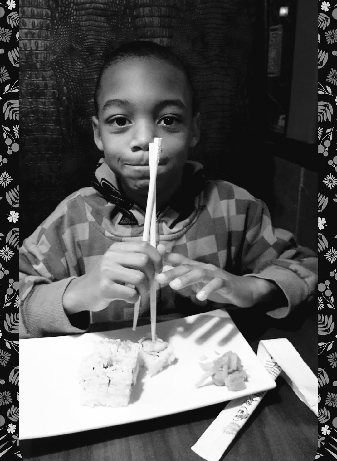 boy eating sushi
